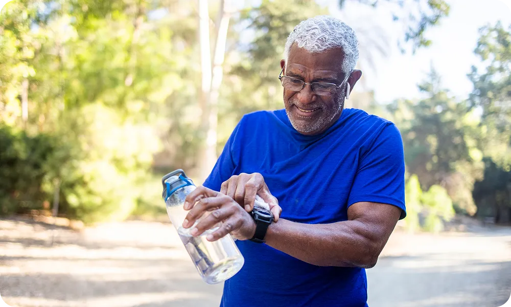 woman with blue long sleeve shirt scrolling on phone